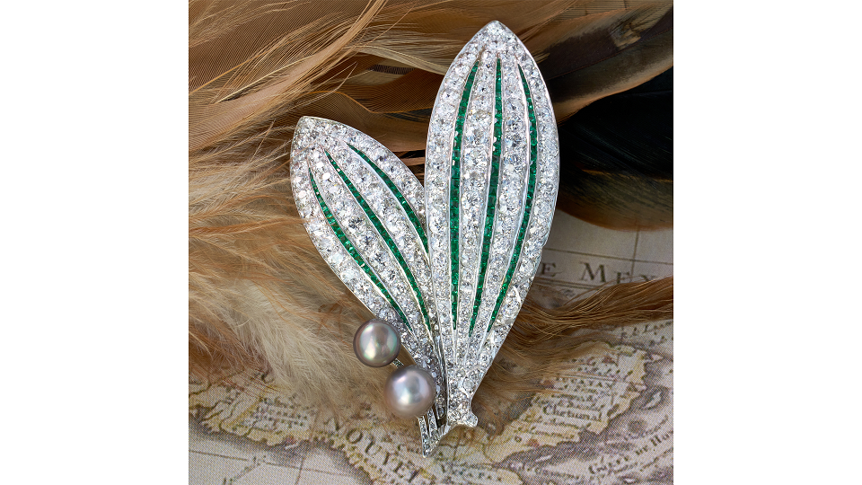 Art Deco diamond, emerald, natural pearl and platinum brooch, courtesy JS Fearnley (@jsfearnley).