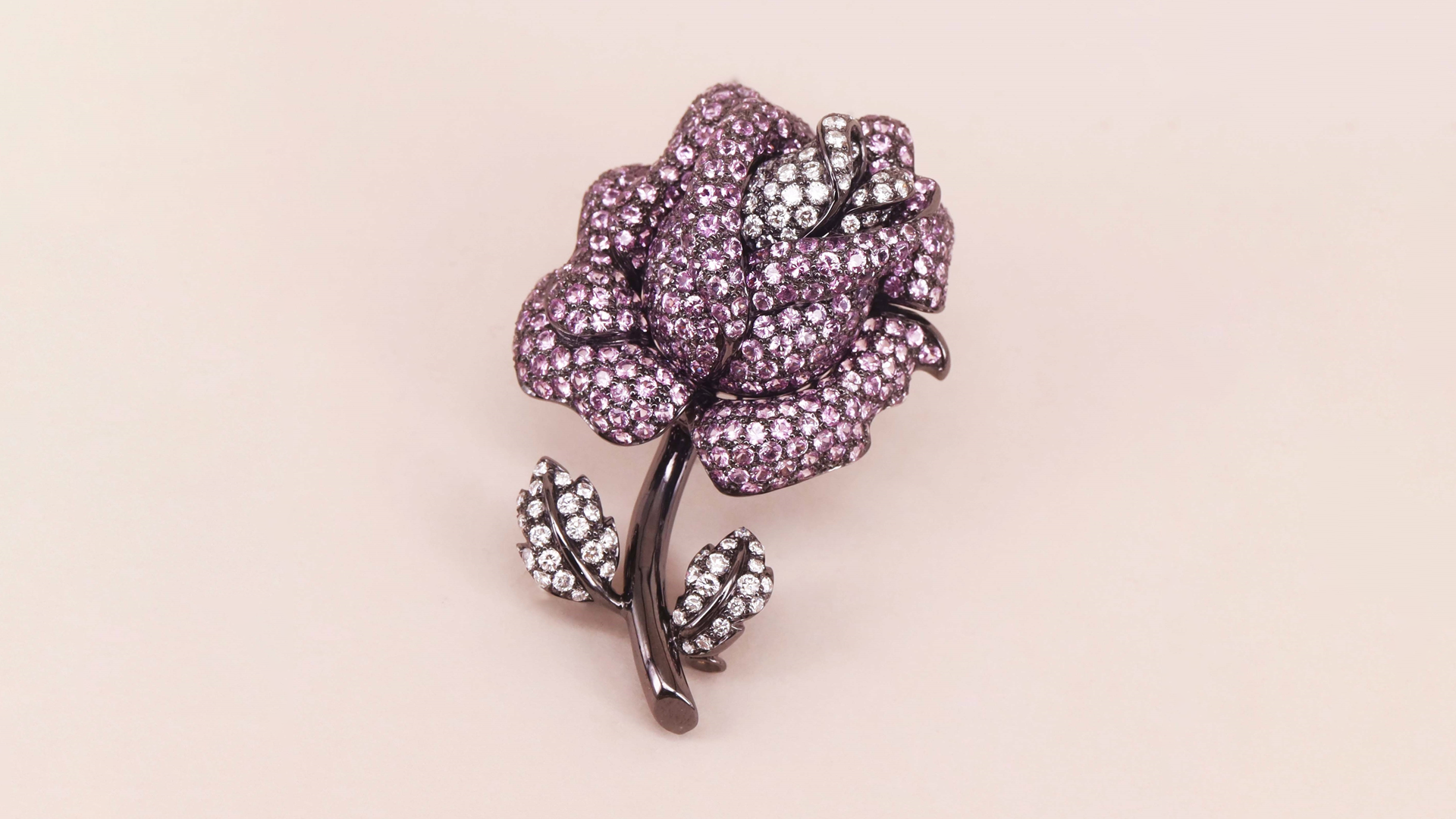 Diamond, pink sapphire and blackened 18-karat gold rose brooch, courtesy Chien’s Collection (@chiens.collection).