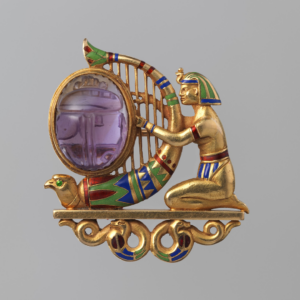 Gold, amethyst, demantoid garnet and enamel brooch, created by Theodore B. Starr, circa 1900, from the collection of the Metropolitan Museum of Art, gift of Jacqueline Loewe Fowler, 2013, public domain, courtesy WikiCommons.