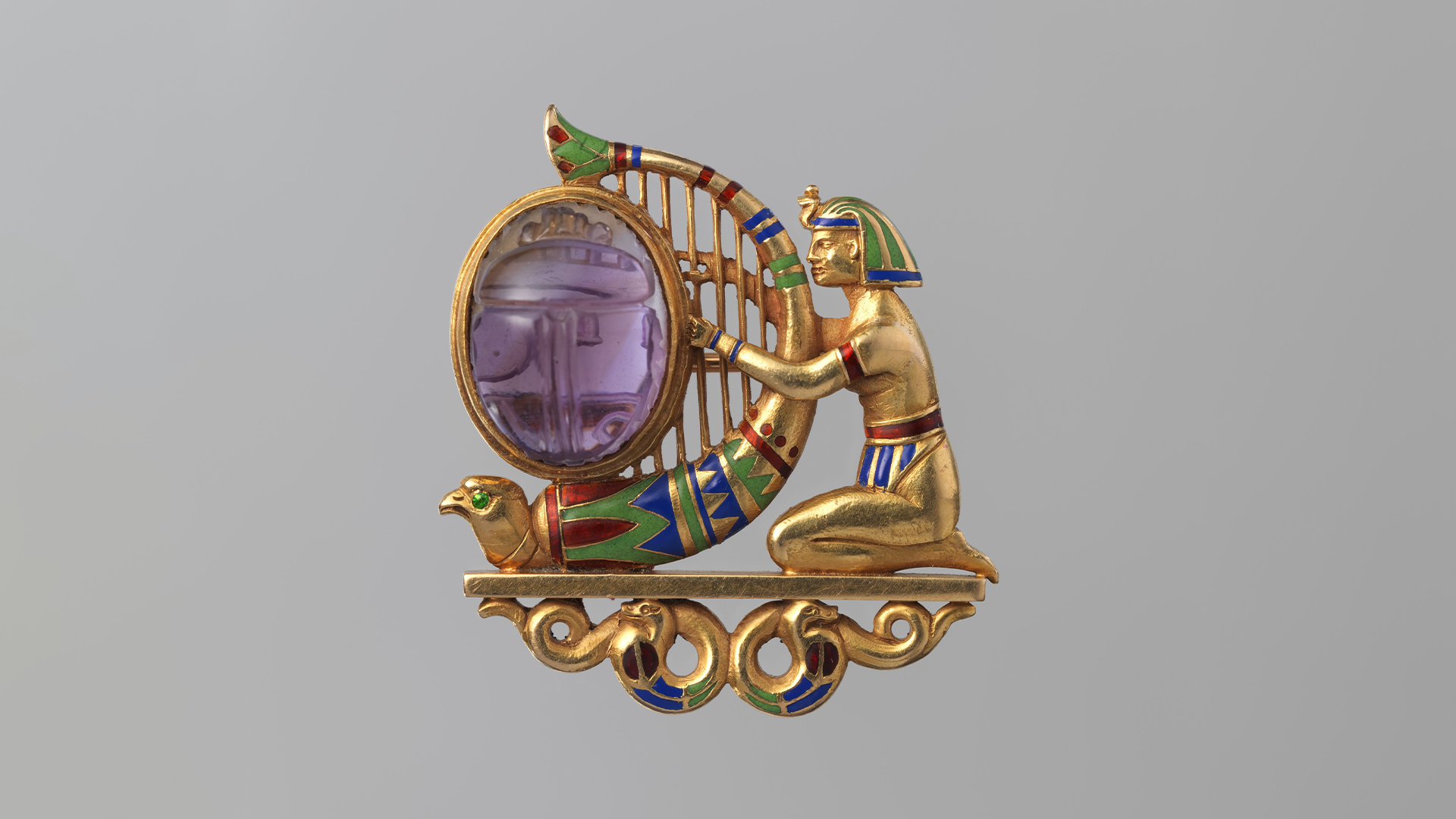 Gold, amethyst, demantoid garnet and enamel brooch, created by Theodore B. Starr, circa 1900, from the collection of the Metropolitan Museum of Art, gift of Jacqueline Loewe Fowler, 2013, public domain, courtesy WikiCommons.