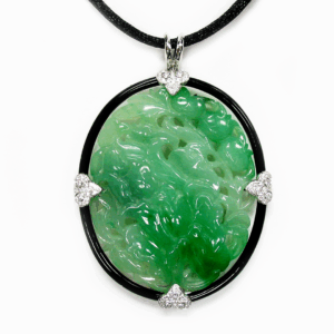 Carved natural jadeite, diamond, onyx and 18-karat white gold floral motif pendant, courtesy, J.&S.S. DeYoung (@laurendeyoungjewelry).